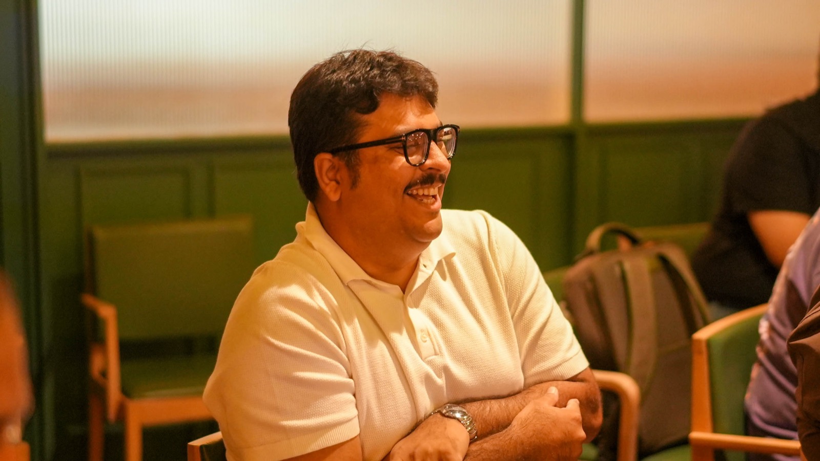 An attendee listening during a session at Miles Ahead Mumbai
