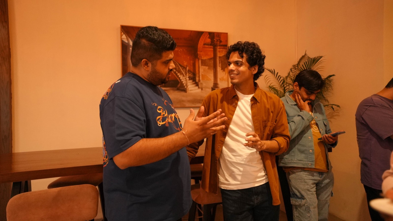 Two attendees in conversation at Miles Ahead Mumbai