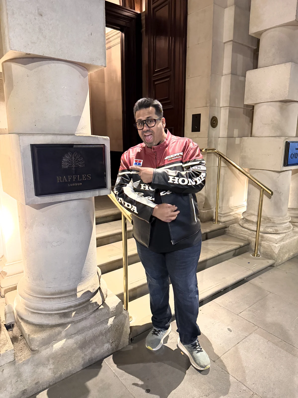 Aadil at the Raffles plaque, 57 Whitehall