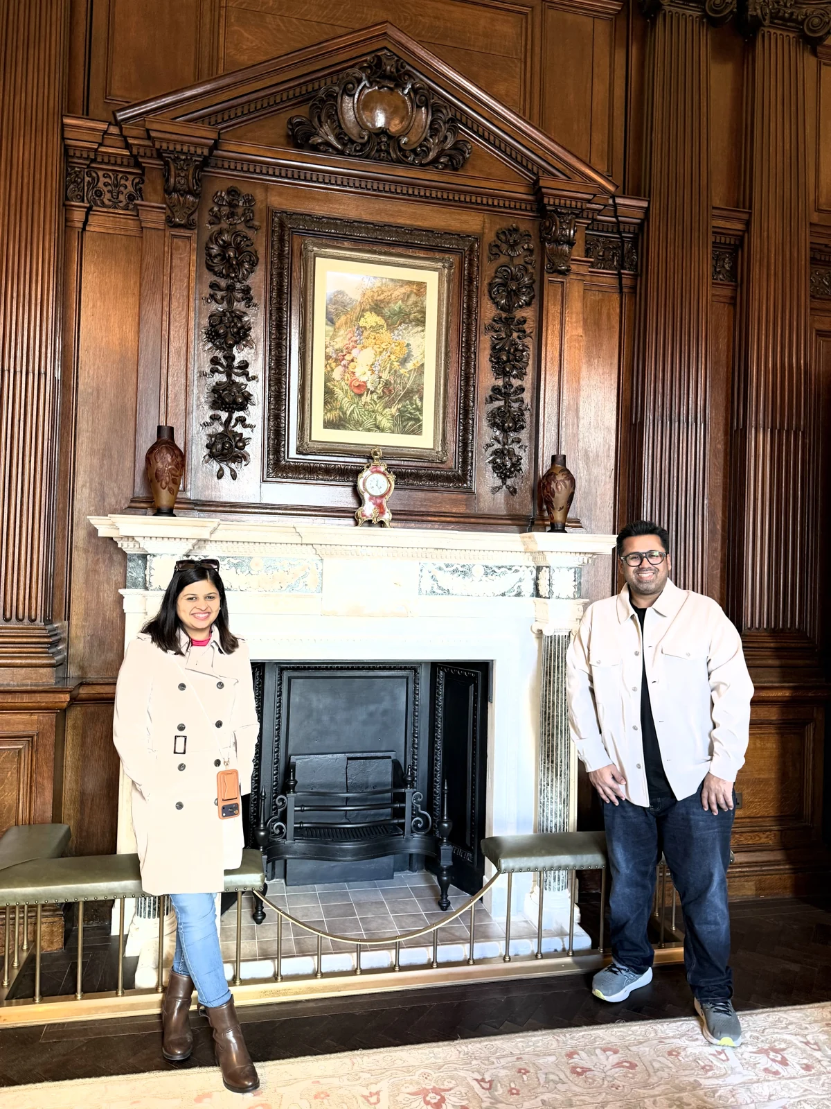 Aadil and Saniya by the carved fireplace in the Granville Suite