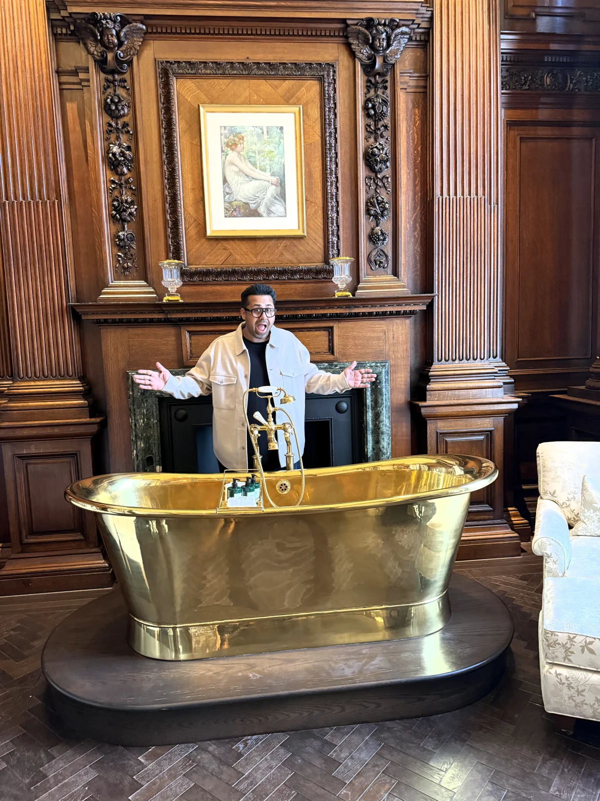 Golden bathtub in the oak-panelled Granville Suite, Raffles London