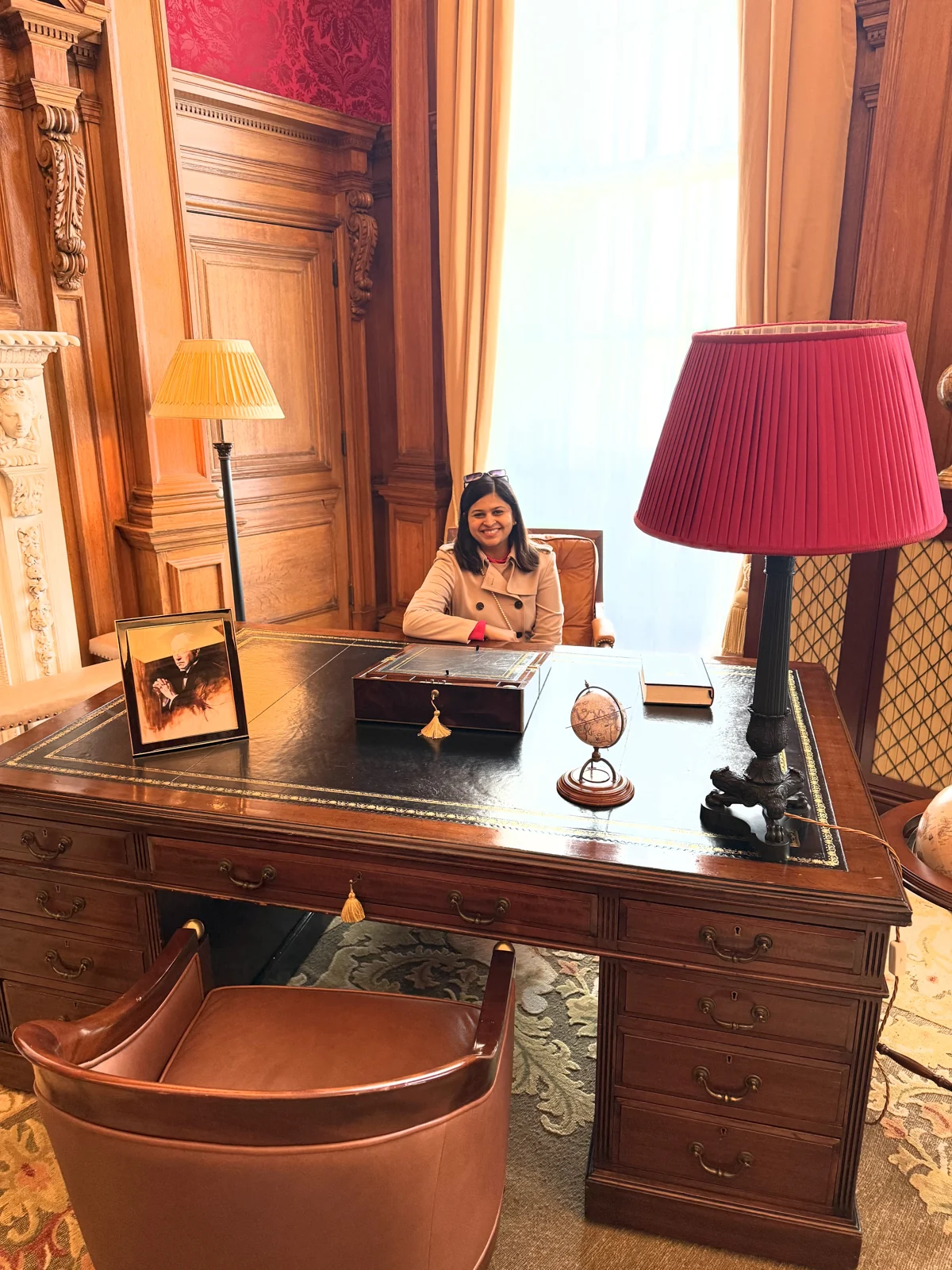 Saniya at the writing desk in the Haldane Suite, Raffles London
