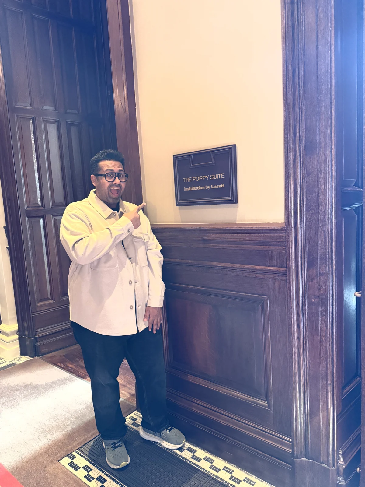 Aadil at the door of the Poppy Suite, Raffles London