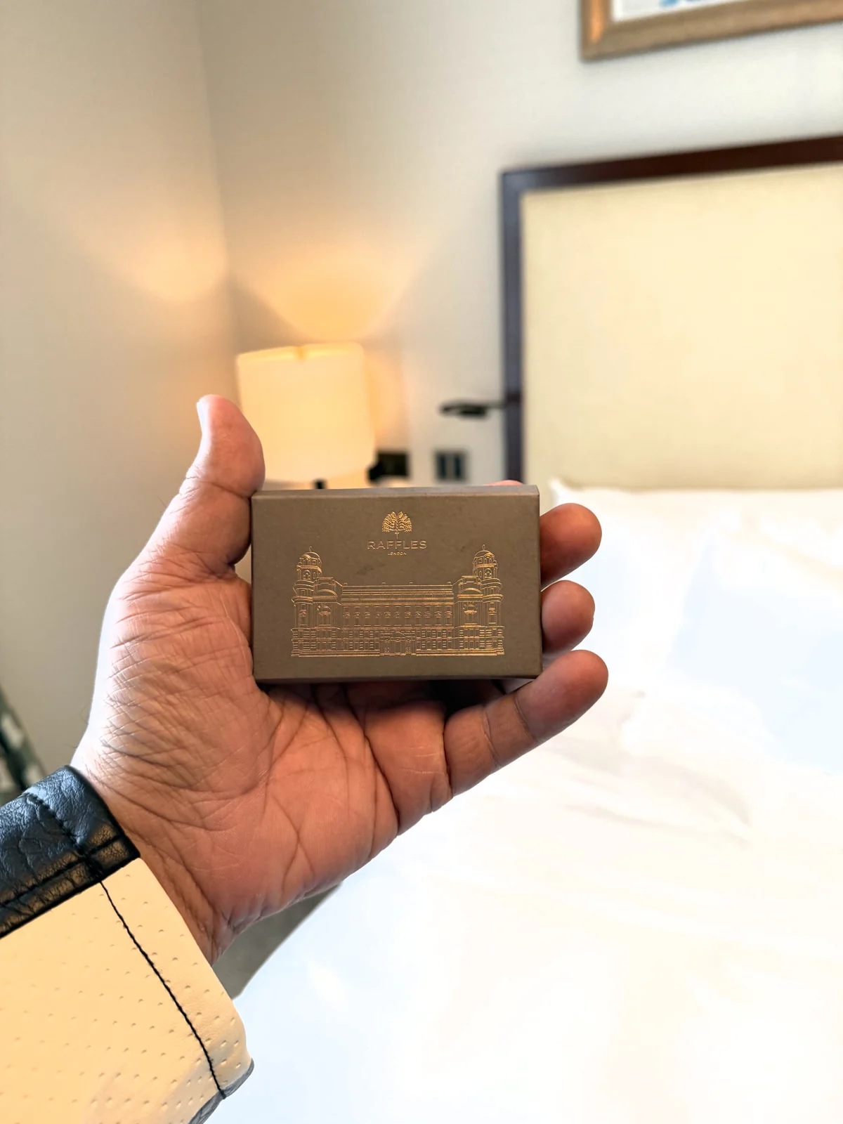 Raffles London room key in an embossed case showing the Old War Office facade