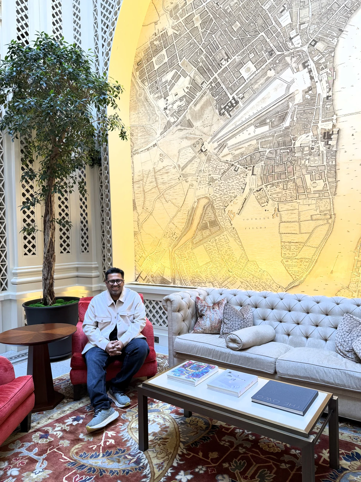 Aadil under the glass roof and mural at Saison, Raffles London